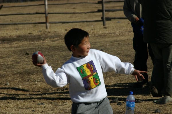 A Mongolian boy at a remote homestead just outside Ulaan Baataar in Mongolia with a Tanner De Witt rugby ball.