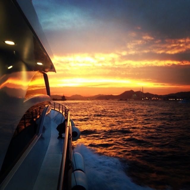 Sunset on board the yacht on the way to Lamma Island for seafood dinner