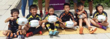 Mini Rugby Club members receive their balls